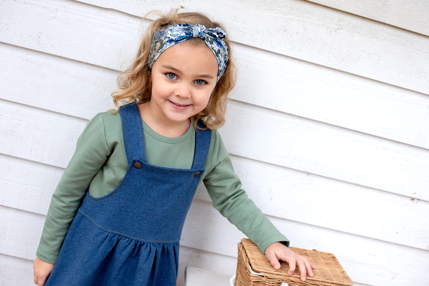 Denim blue pinafore dress with butterfly appliqué